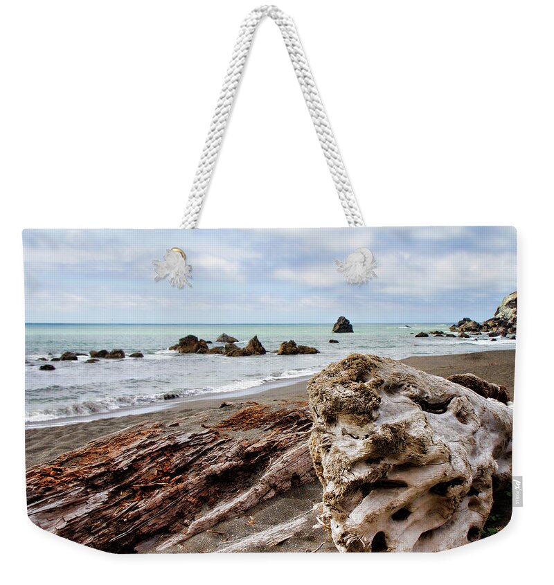 Beach Weekender Tote Bag featuring the photograph Driftwood by Lana Trussell
