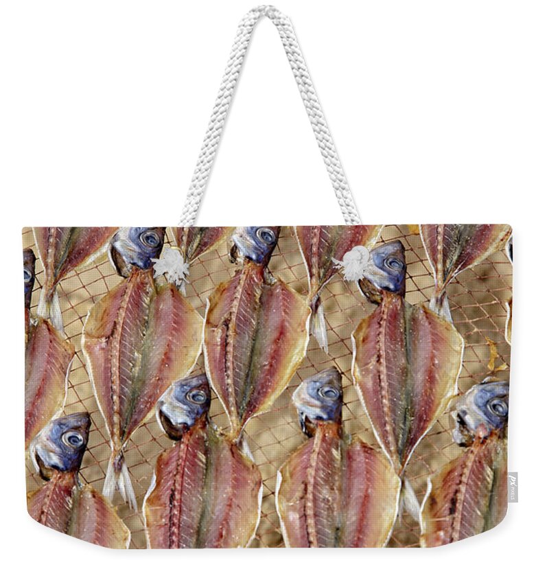 Abstract Weekender Tote Bag featuring the photograph Drying Fish on a Rack by Heiko Koehrer-Wagner