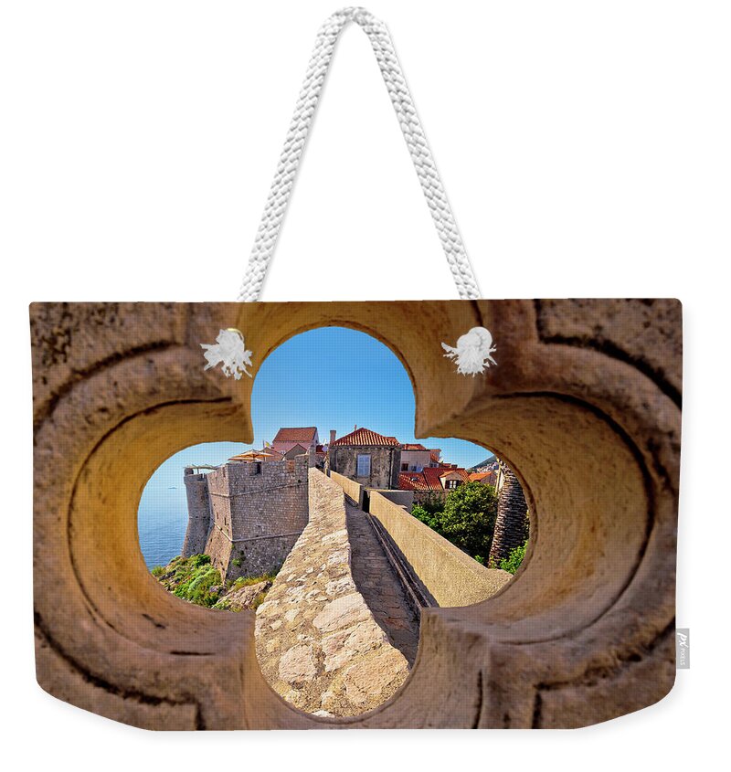 Dubrovnik Weekender Tote Bag featuring the photograph Dubrovnik city walls view through stone carved detail by Brch Photography
