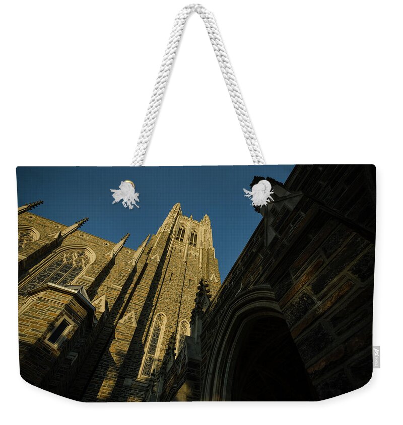 Fall Weekender Tote Bag featuring the photograph Duke Chapel Shadows and Golden Sunset by Anthony Doudt