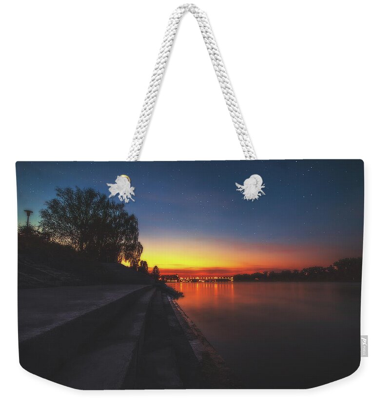 Dusk Weekender Tote Bag featuring the photograph Dusk at the Riverside by Marc Braner