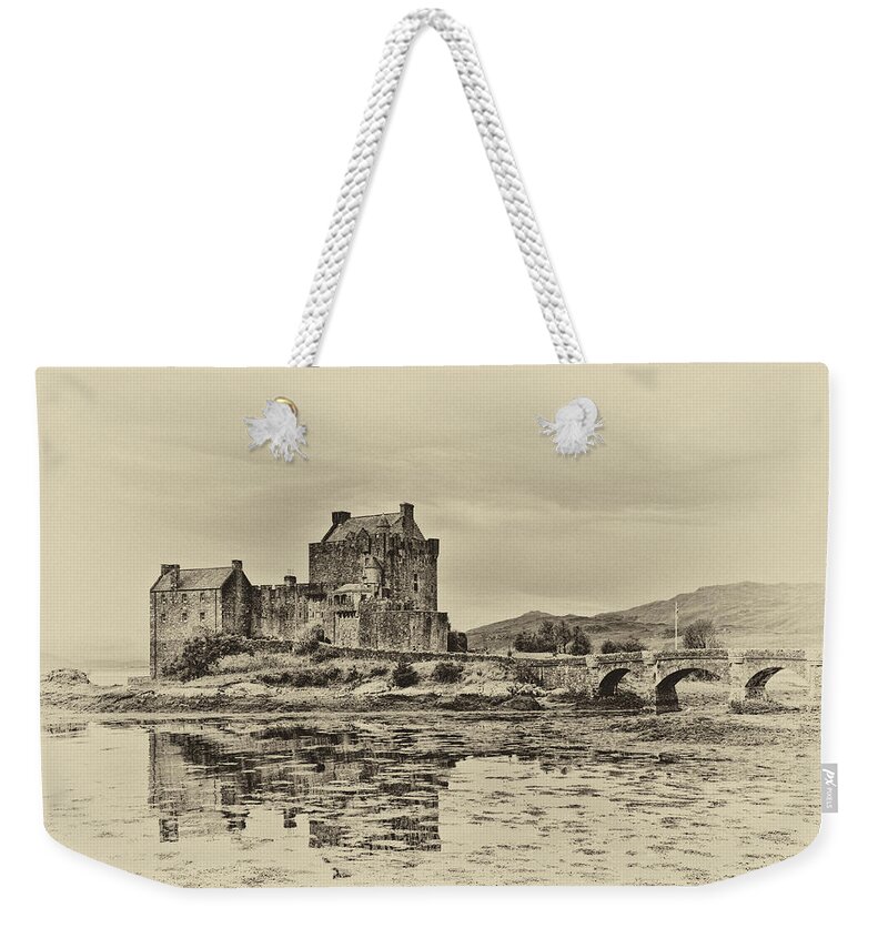Eilean Donan Castle Weekender Tote Bag featuring the photograph Eilean Donan Castle by Chris Thaxter
