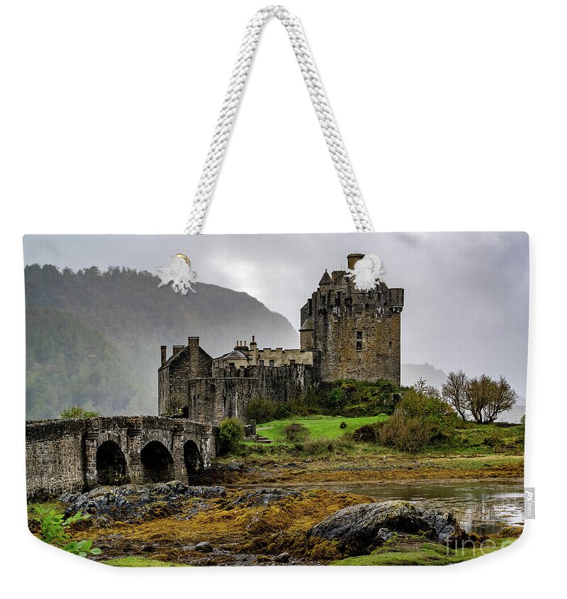 Eilean Donan Castle Weekender Tote Bag featuring the photograph Eilean Donan Castle by Sue Karski