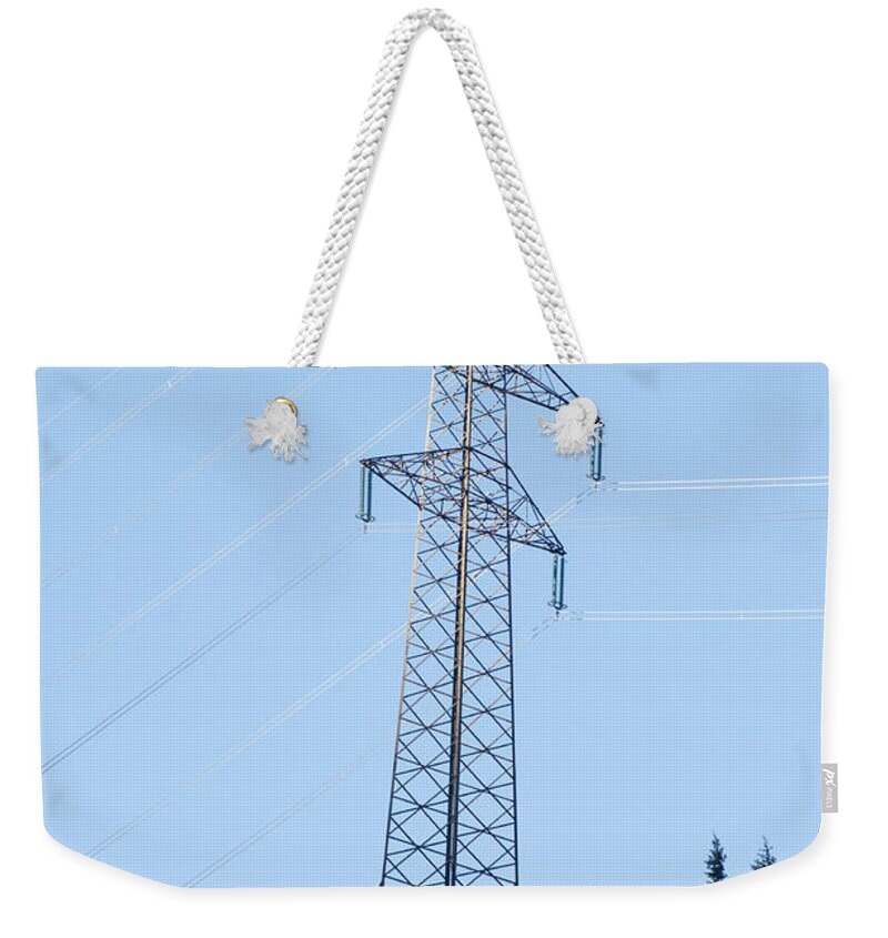 Electric Weekender Tote Bag featuring the photograph Electric pylon on blue sky by Ilan Rosen