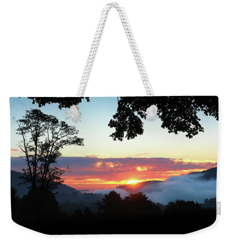 Sunrise Weekender Tote Bag featuring the photograph Embracing the Dawn by Everett Houser