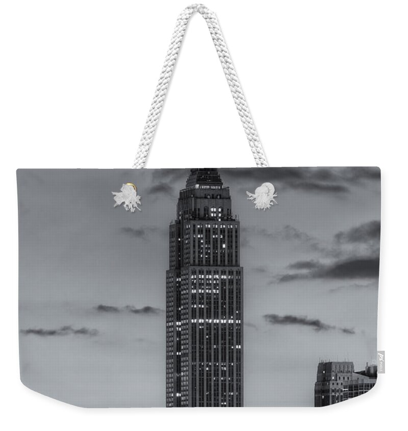 Clarence Holmes Weekender Tote Bag featuring the photograph Empire State Building Morning Twilight IV by Clarence Holmes