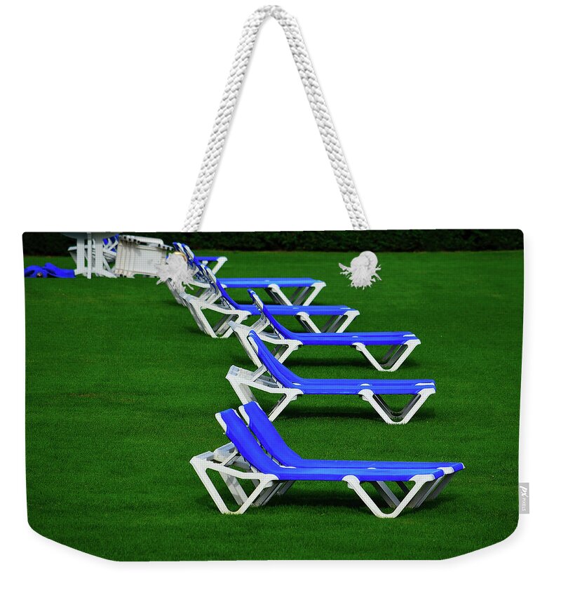 Lawn Chairs Weekender Tote Bag featuring the photograph End of Season II by Richard Ortolano
