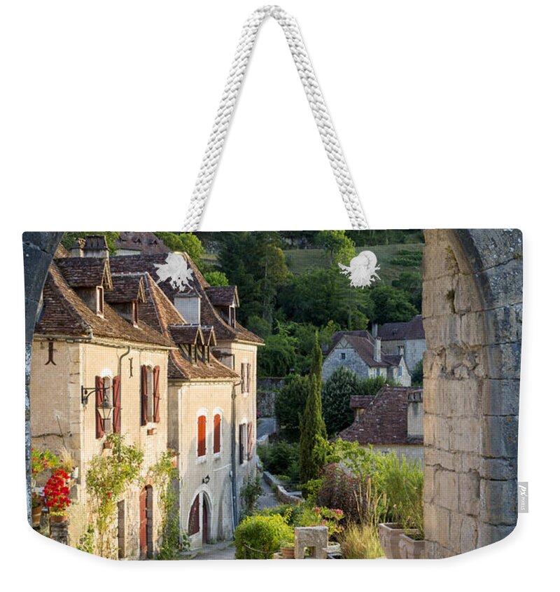 French Weekender Tote Bag featuring the photograph Entry Gate to Saint-Cirq-Lapopie by Brian Jannsen