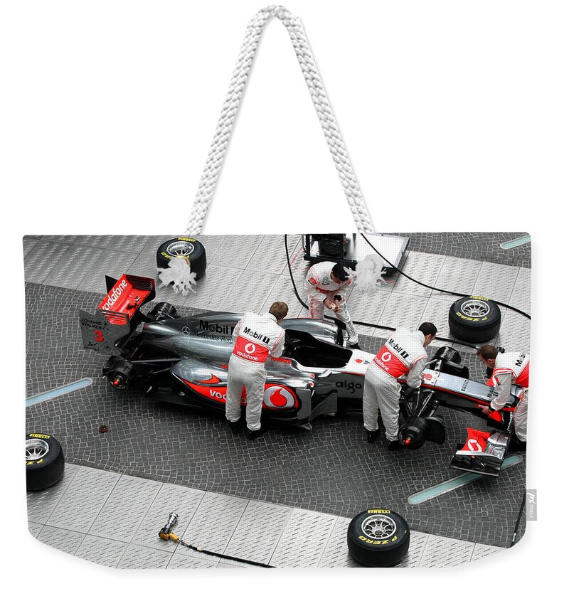 F1 Weekender Tote Bag featuring the photograph F1 by Mariel Mcmeeking
