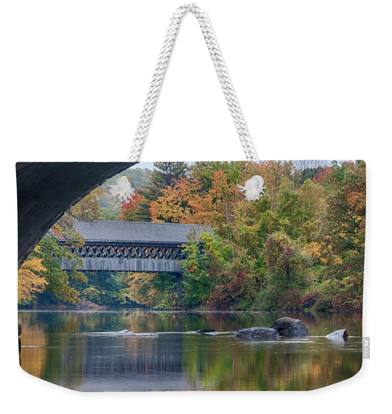  Weekender Tote Bag featuring the photograph fall colors over Henniker covered bridge by Jeff Folger