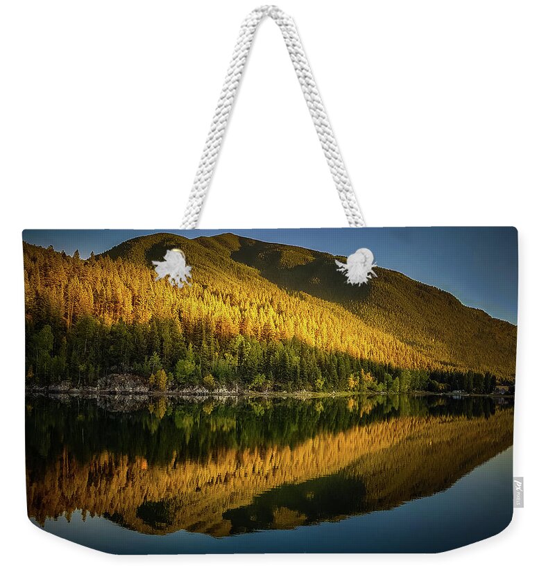 Blue Weekender Tote Bag featuring the photograph Fall sunset by Thomas Nay