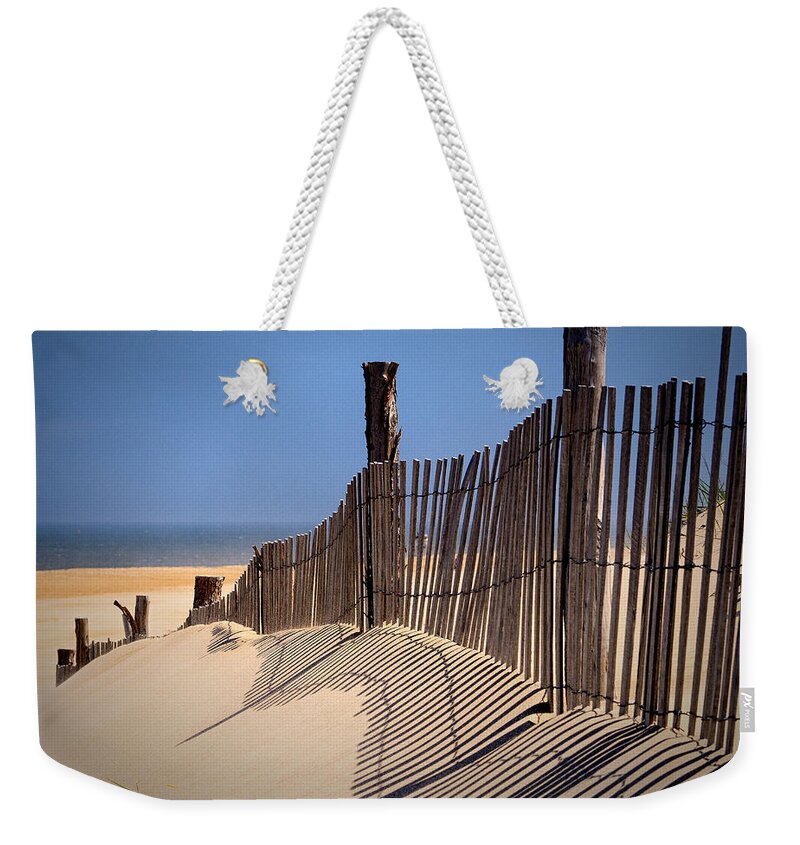 Fenwick Island Weekender Tote Bag featuring the photograph Fenwick Dune Fence and Shadows by Bill Swartwout