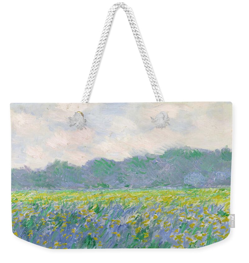Field Weekender Tote Bag featuring the painting Field of Yellow Irises at Giverny by Claude Monet