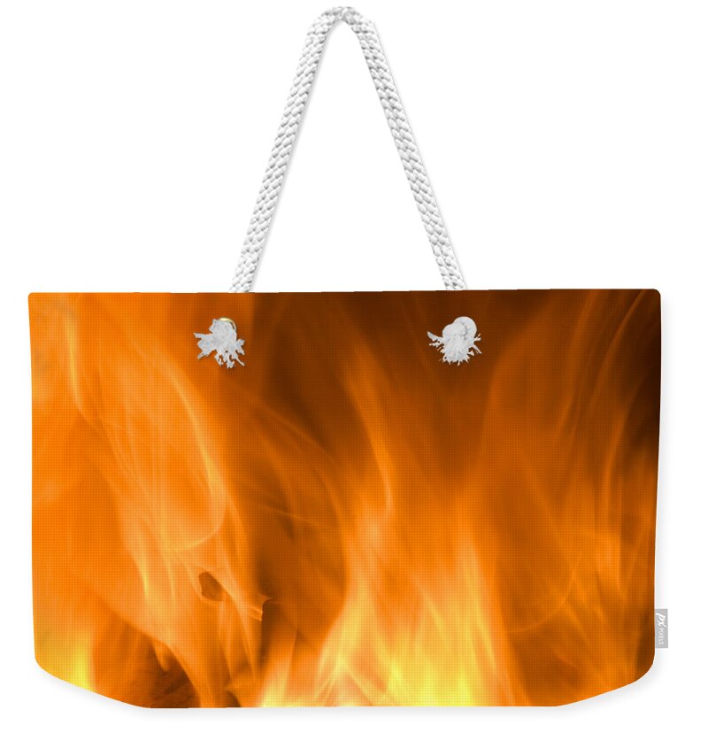 Fire Background Weekender Tote Bag featuring the photograph Fire flames background by Michalakis Ppalis