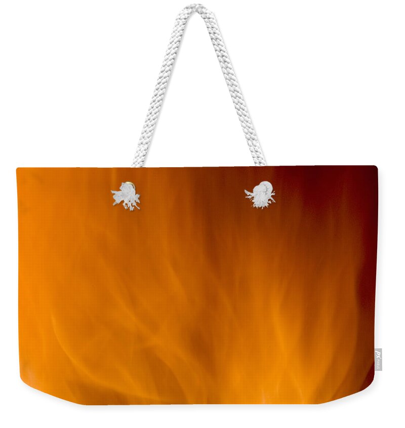 Fire Background Weekender Tote Bag featuring the photograph Fire orange abstract background by Michalakis Ppalis