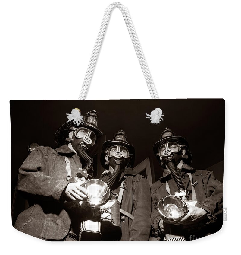 1950s Weekender Tote Bag featuring the photograph Firemen In Gas Masks, C.1950s by H. Armstrong Roberts/ClassicStock