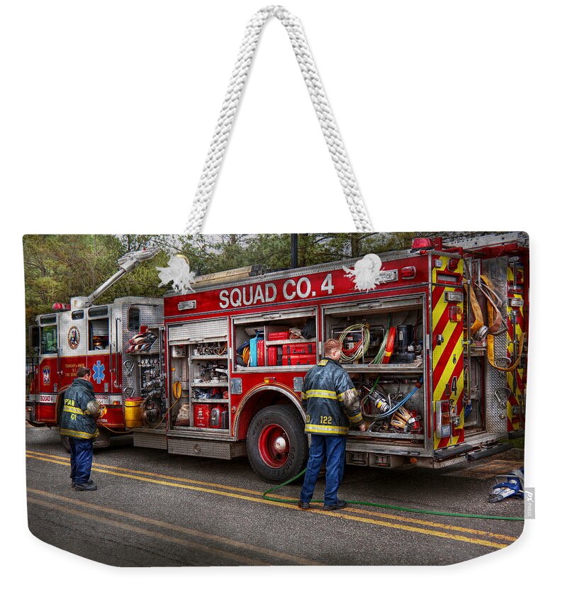 Firemen Weekender Tote Bag featuring the photograph Firemen - The modern fire truck by Mike Savad