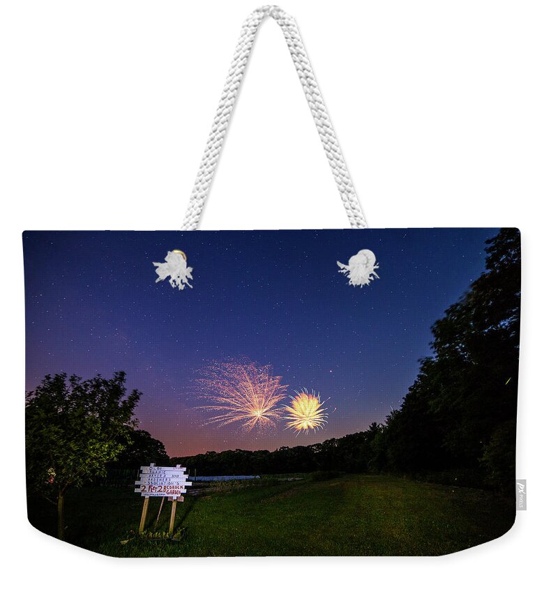 Fireworks Weekender Tote Bag featuring the photograph Fireworks and the Stars by John Meader