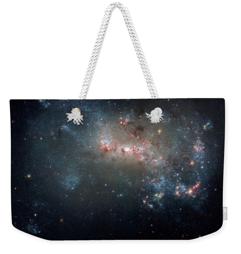The Universe Weekender Tote Bag featuring the photograph Fireworks in a Magellanic Dwarf Galaxy by Jennifer Rondinelli Reilly - Fine Art Photography