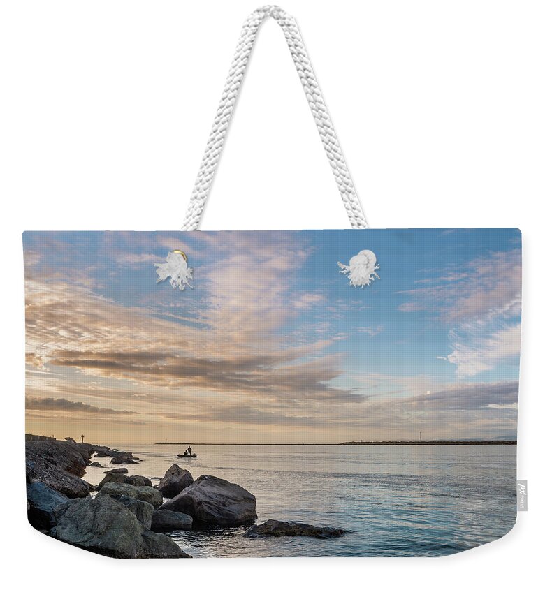 South Jetty Weekender Tote Bag featuring the photograph Fishing Along the South Jetty by Greg Nyquist