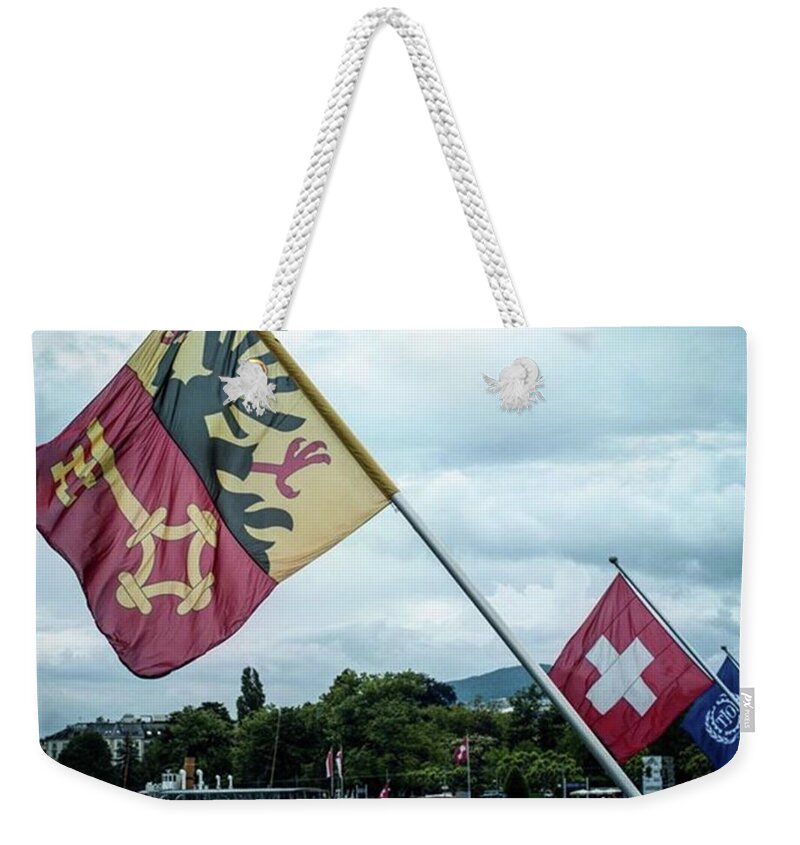 Aleckc Weekender Tote Bag featuring the photograph Flags & Ferry by Aleck Cartwright