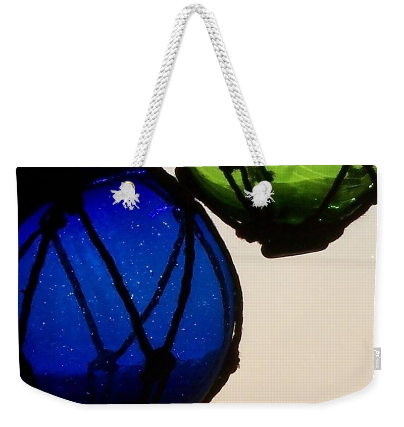 Glass Floats Weekender Tote Bag featuring the photograph Floats by Jackie Mueller-Jones