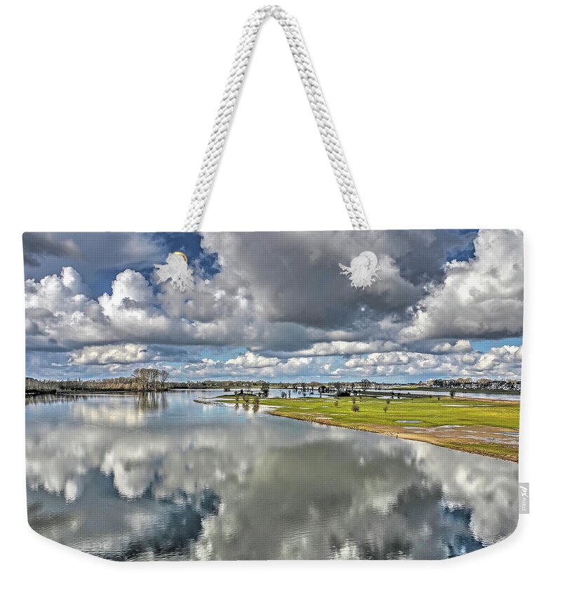 Deventer Weekender Tote Bag featuring the photograph Flooded plains near Deventer by Frans Blok
