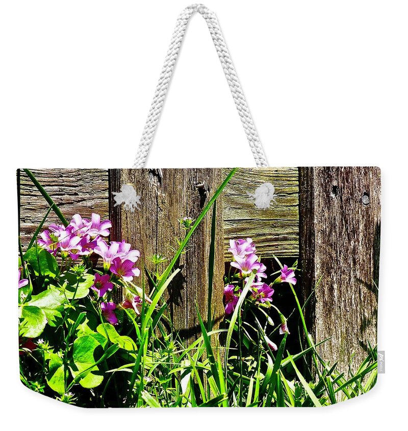 Flowers Weekender Tote Bag featuring the photograph Flowers along the fence by Shawn M Greener