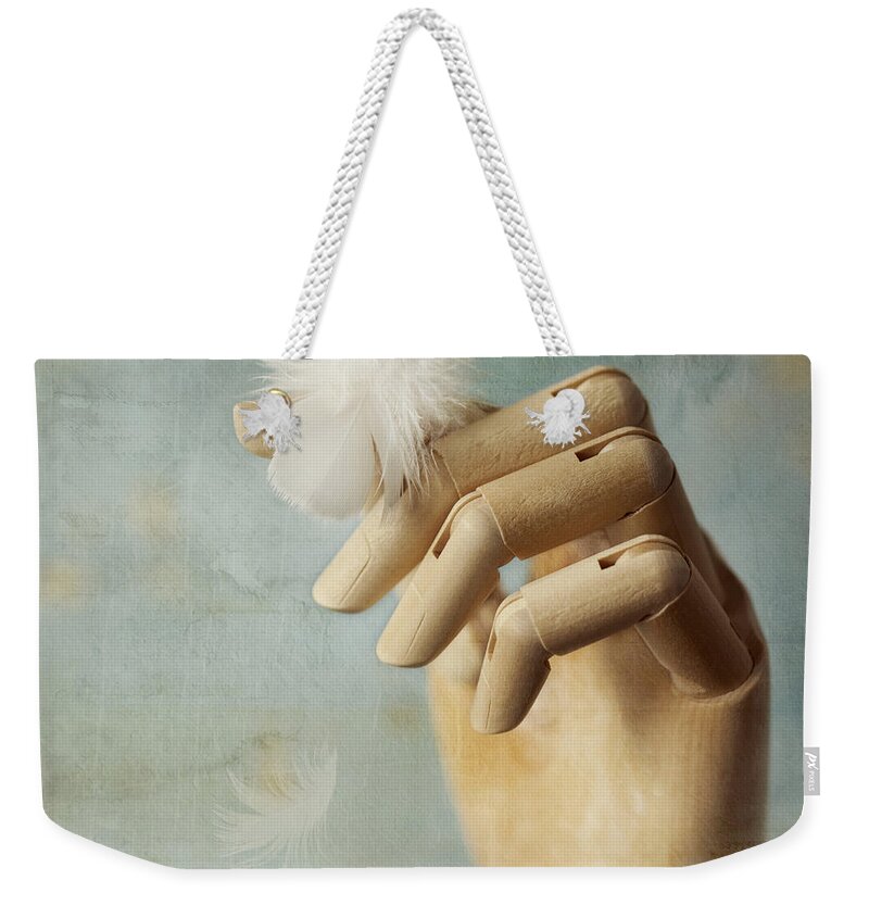 Hand Weekender Tote Bag featuring the photograph Fly Far Away by Amy Weiss