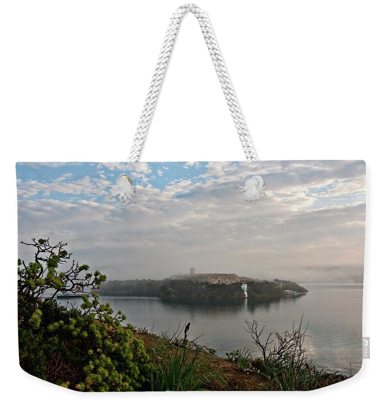  Weekender Tote Bag featuring the photograph Foggy days in bloody island 1 by Pedro Cardona Llambias