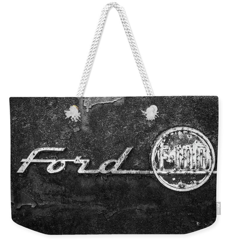 Ford F-100 Emblem Weekender Tote Bag featuring the photograph Ford F-100 Emblem On A Rusted Hood by Matthew Pace