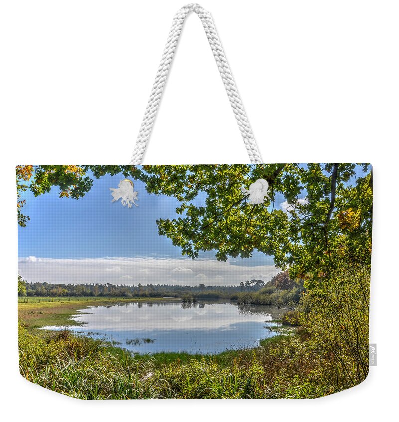 Lake Weekender Tote Bag featuring the photograph Forest Lake Through The Trees by Frans Blok