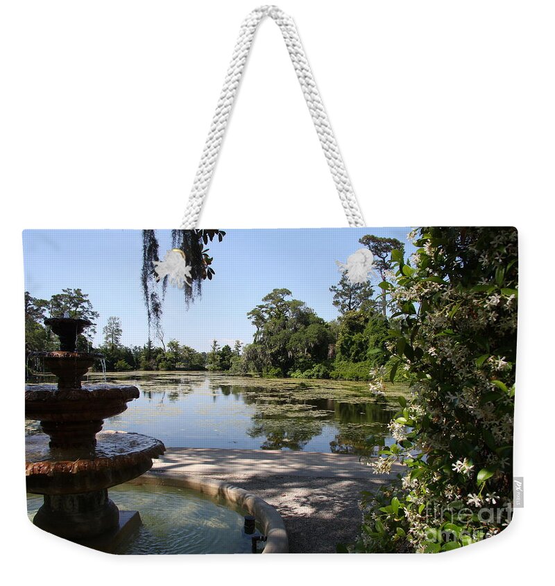 Fountain Weekender Tote Bag featuring the photograph Fountain At The Swamp by Christiane Schulze Art And Photography