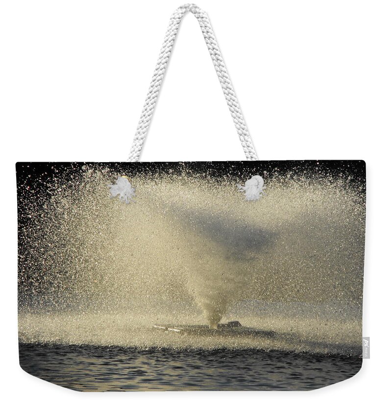 Illusion Weekender Tote Bag featuring the photograph Fountain Tornado Illuminating the Shadow by Michael Oceanofwisdom Bidwell