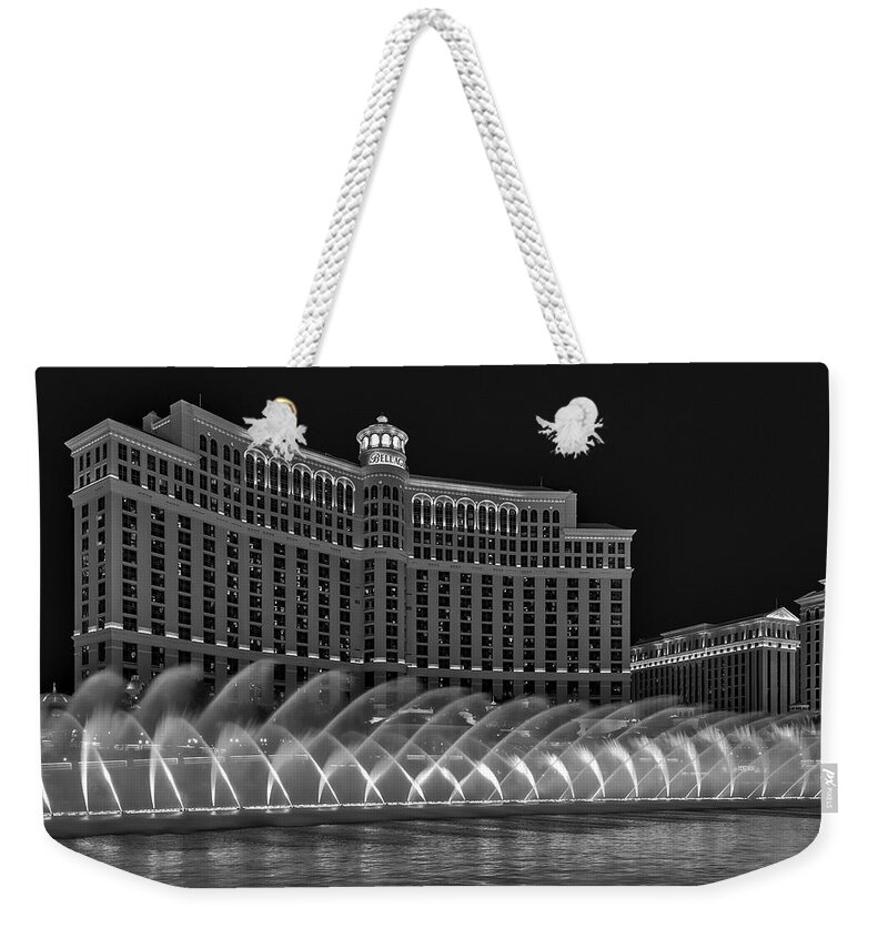 Bellagio Hotel Weekender Tote Bag featuring the photograph Fountains Of Bellagio Hotel BW by Susan Candelario