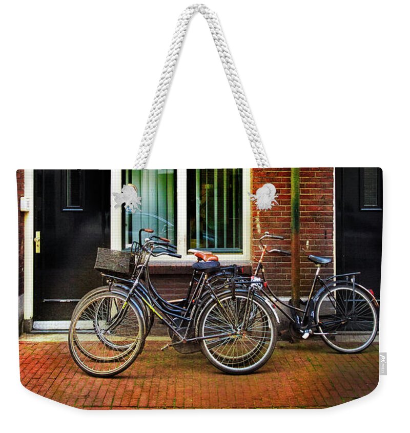 Bicycle Weekender Tote Bag featuring the photograph Four Bicycles In the Den Anspeker by Craig J Satterlee
