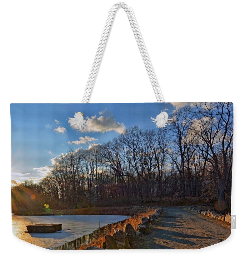 'swan Lake Weekender Tote Bag featuring the photograph Frozen Sunset by Jeffrey Friedkin