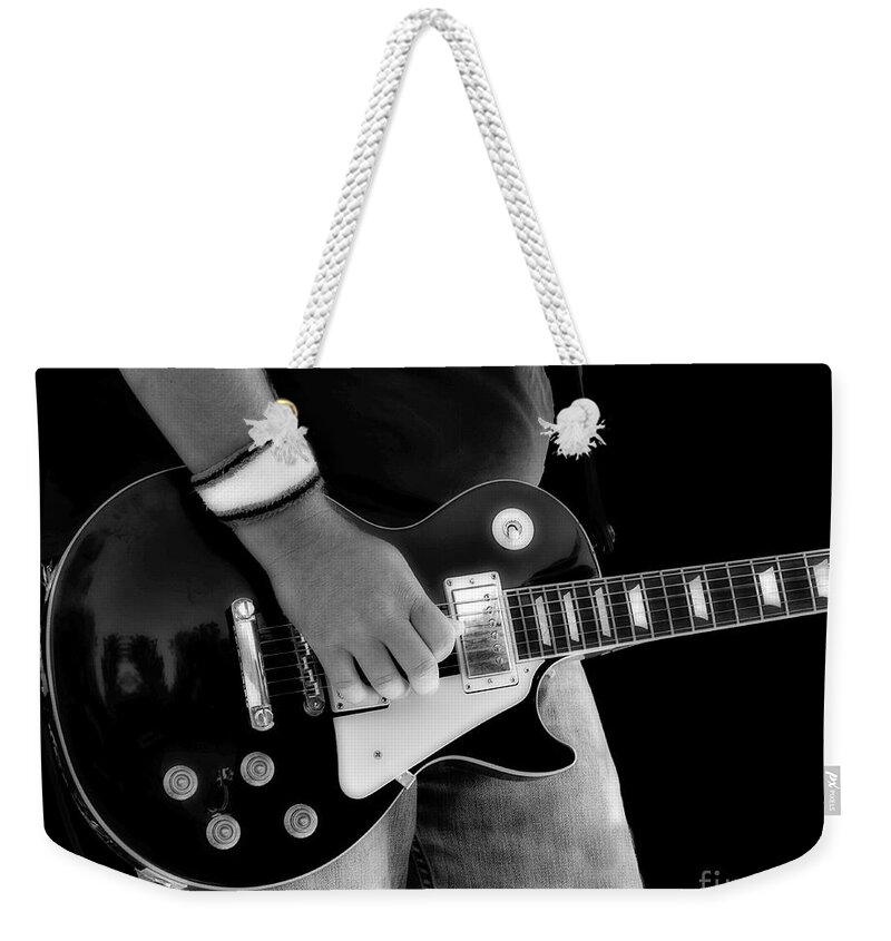 Gibson Weekender Tote Bag featuring the photograph Gibson Les Paul Guitar by Randy Steele