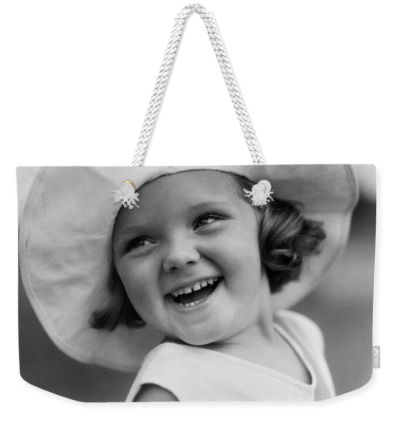 1930s Weekender Tote Bag featuring the photograph Girl In Wide Brimmed Hat, C.1930s by H. Armstrong Roberts/ClassicStock
