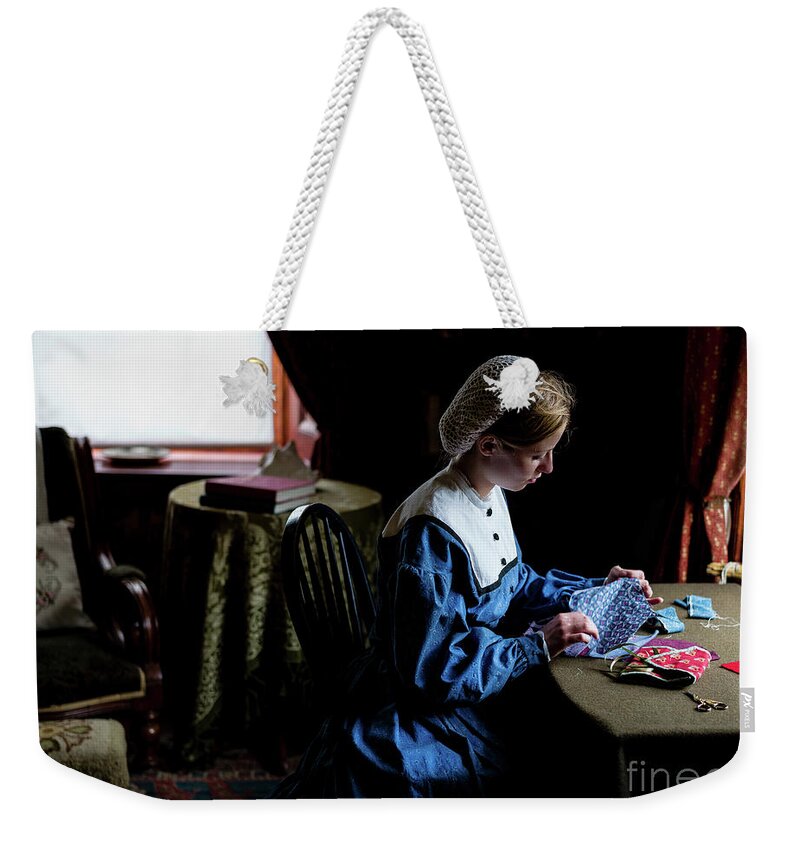 Girl Sewing Weekender Tote Bag featuring the photograph Girl Sewing by M G Whittingham