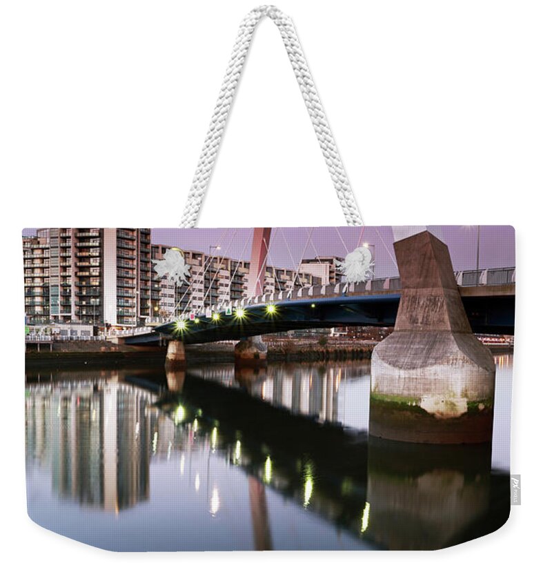 Glasgow Clyde Arc Weekender Tote Bag featuring the photograph Glasgow Clyde Arc Bridge at Sunset by Maria Gaellman