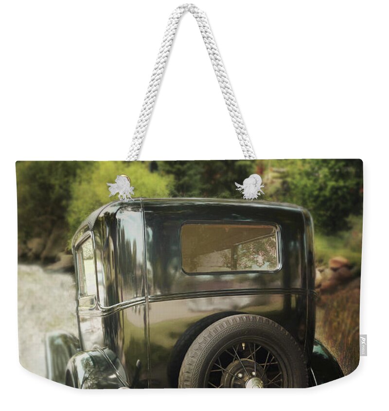 Cars Weekender Tote Bag featuring the photograph Going Home by John Anderson