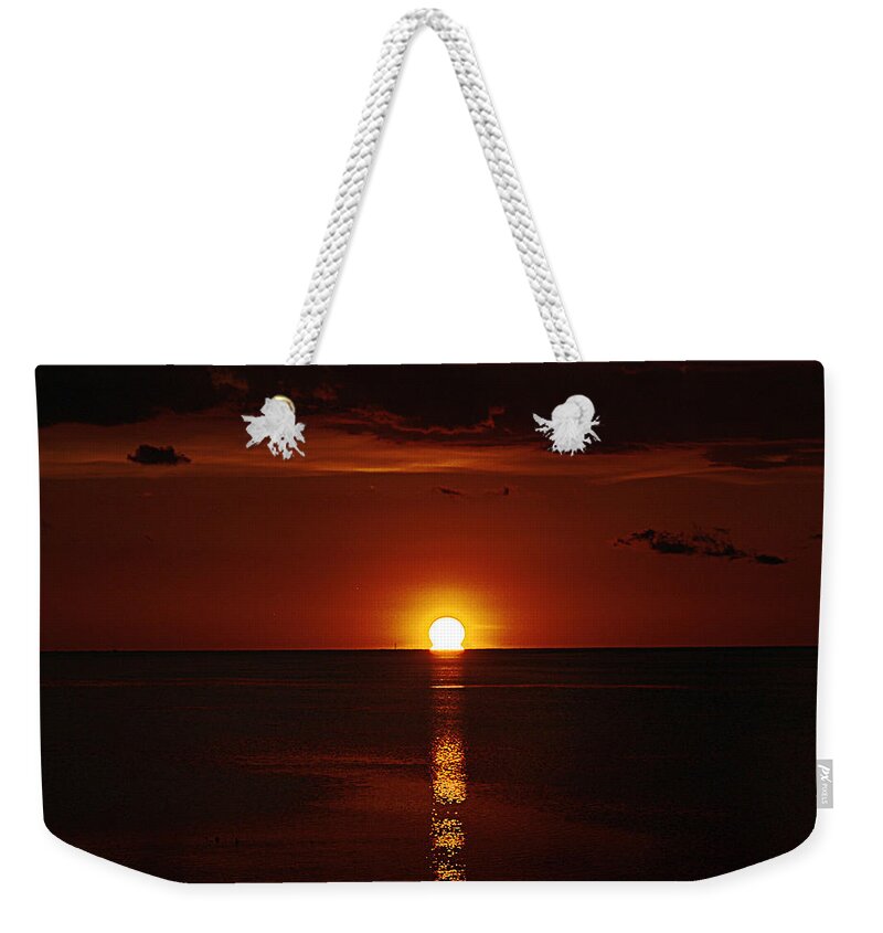 Sunset Weekender Tote Bag featuring the photograph Going In by Bob Johnson
