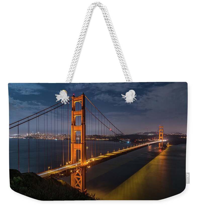Golden Gate Weekender Tote Bag featuring the photograph Golden Reflection by Bryan Xavier