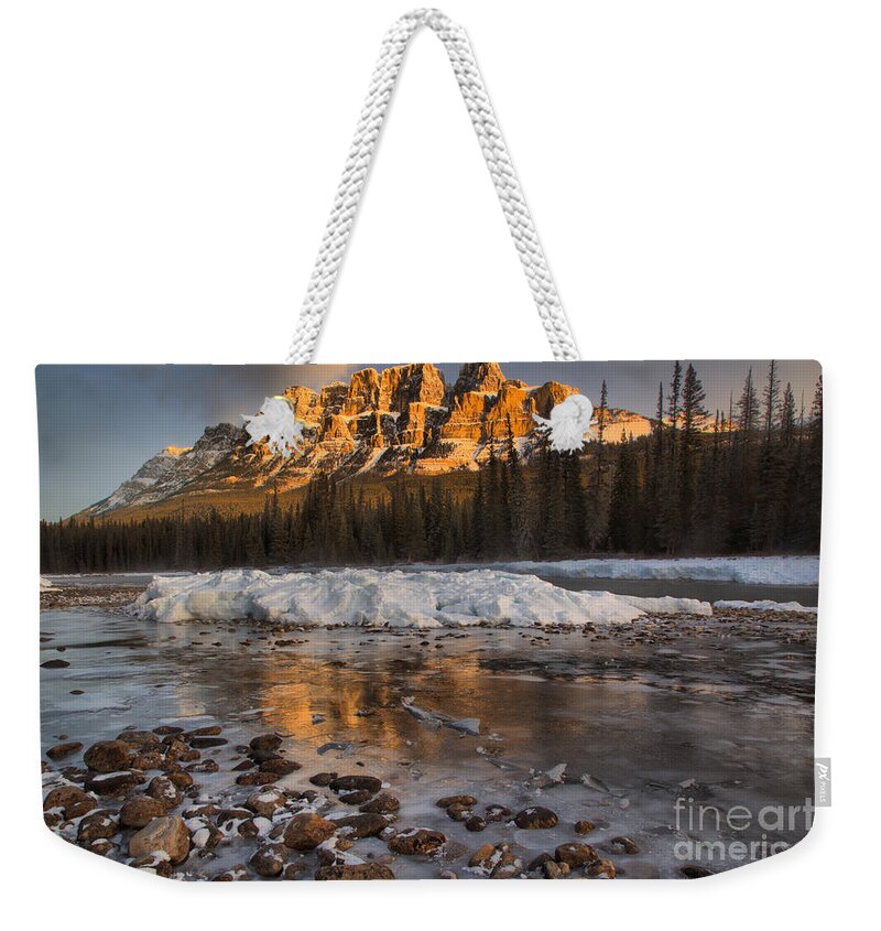 Castle Mountain Weekender Tote Bag featuring the photograph Golden Reflections By The River Rocks by Adam Jewell