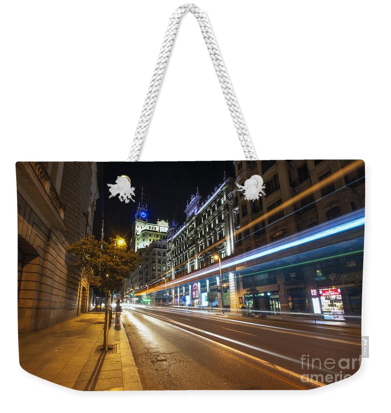 Yhun Suarez Weekender Tote Bag featuring the photograph Gran Via Light Trails 1.0 by Yhun Suarez