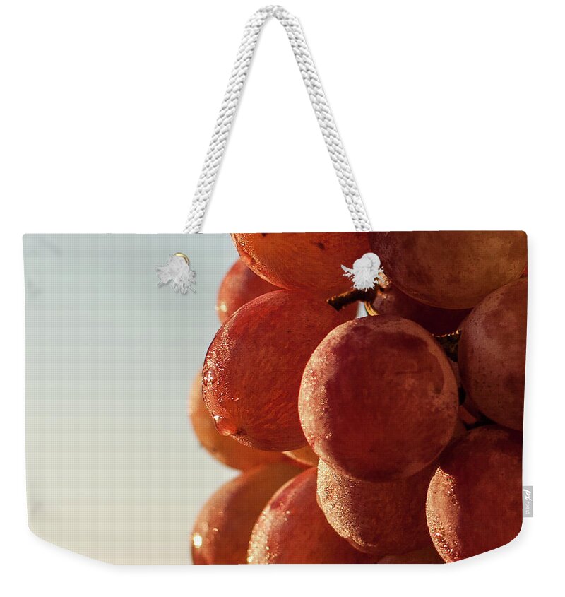 Grapes Cluster Weekender Tote Bag featuring the photograph Grapes cluster by Sergey Simanovsky