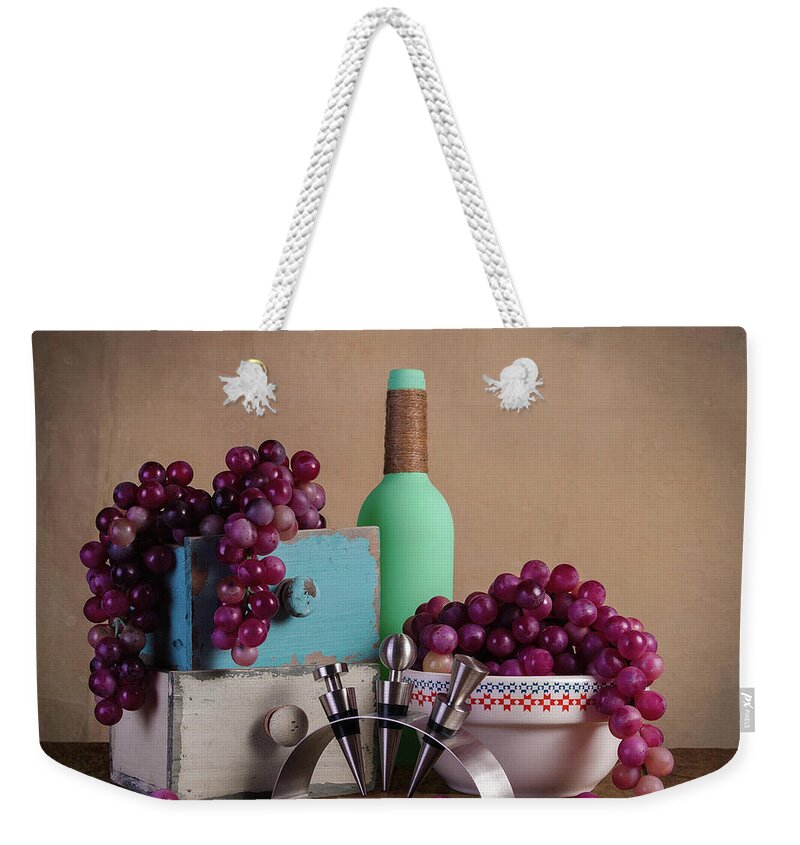 Alcohol Weekender Tote Bag featuring the photograph Grapes with Wine Stoppers by Tom Mc Nemar