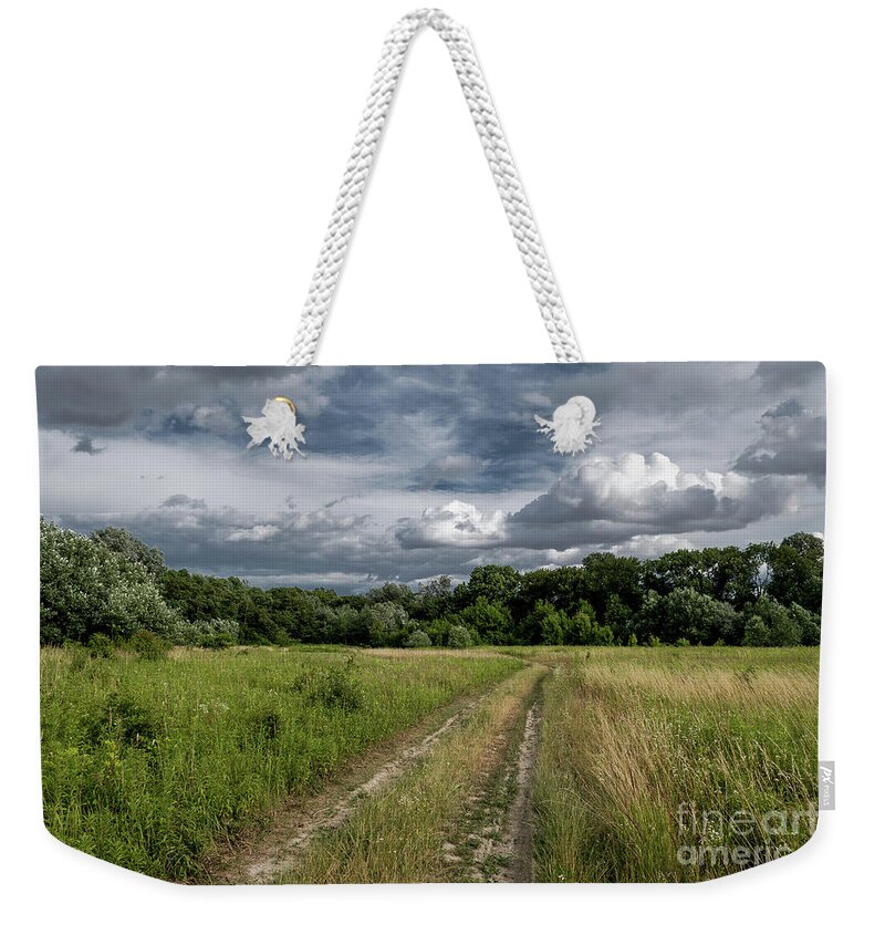 Acre Weekender Tote Bag featuring the photograph Gravel road through scenic landscape in a national park in Austria by Andreas Berthold