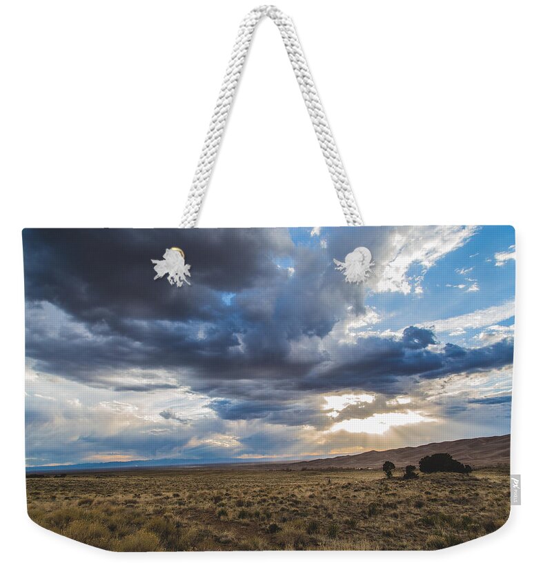 Clouds Weekender Tote Bag featuring the photograph Great Sand Dunes Stormbreak by Jason Roberts
